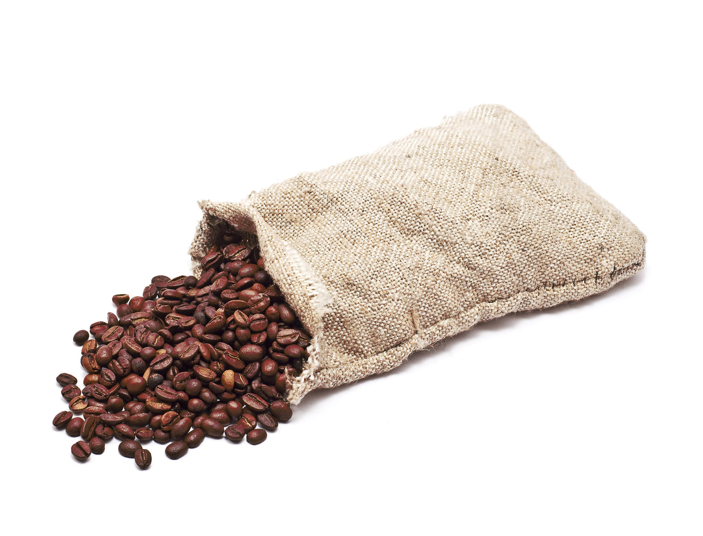 Open beige fabric bag spilling out coffee beans on a white background